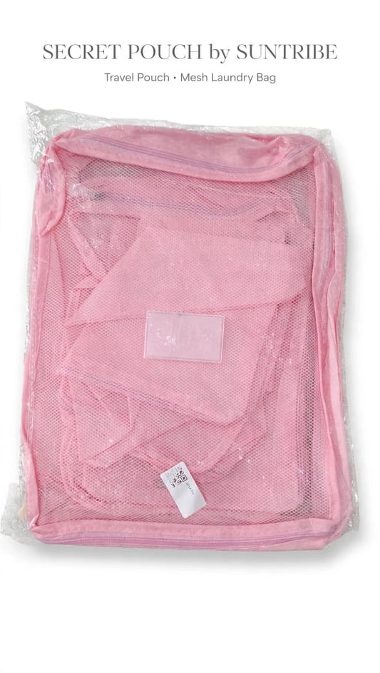 Pink Suntribe Secret Pouch travel organiser and mesh laundry bag in packaging